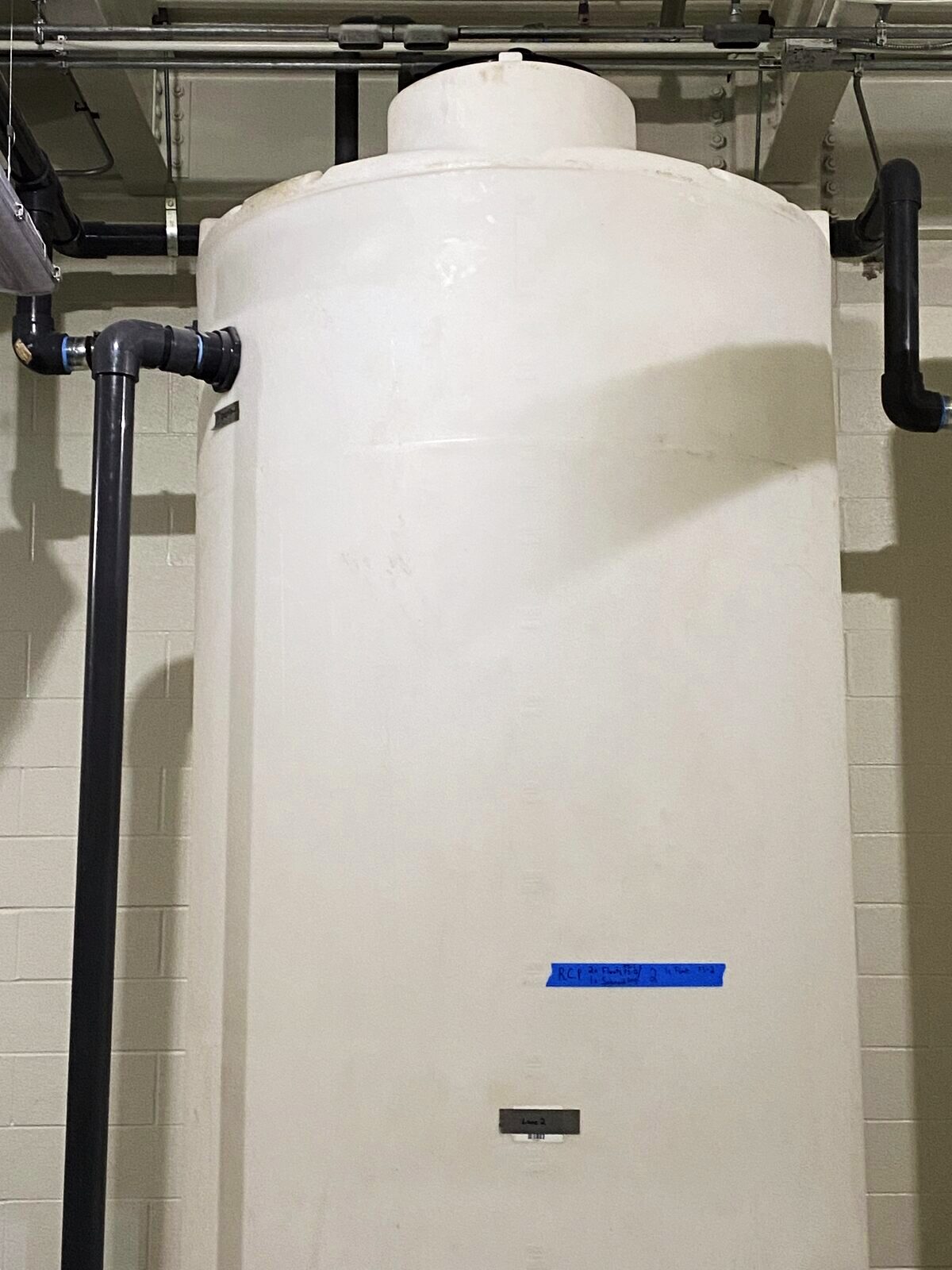 Chemical feed tanks with process piping