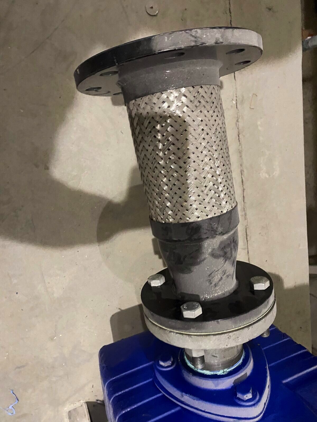 Braided stainless flex connector on a flanged valve