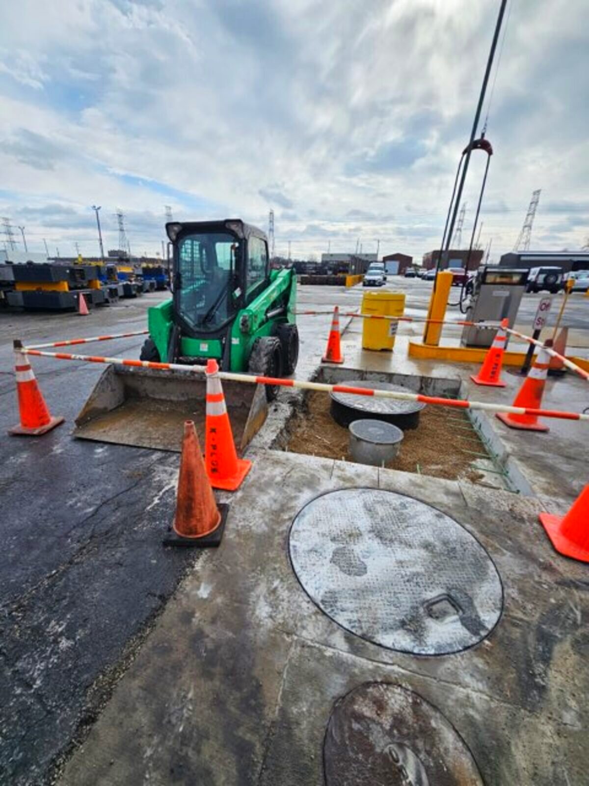 Concrete and site work at a KPM project with equipment staged