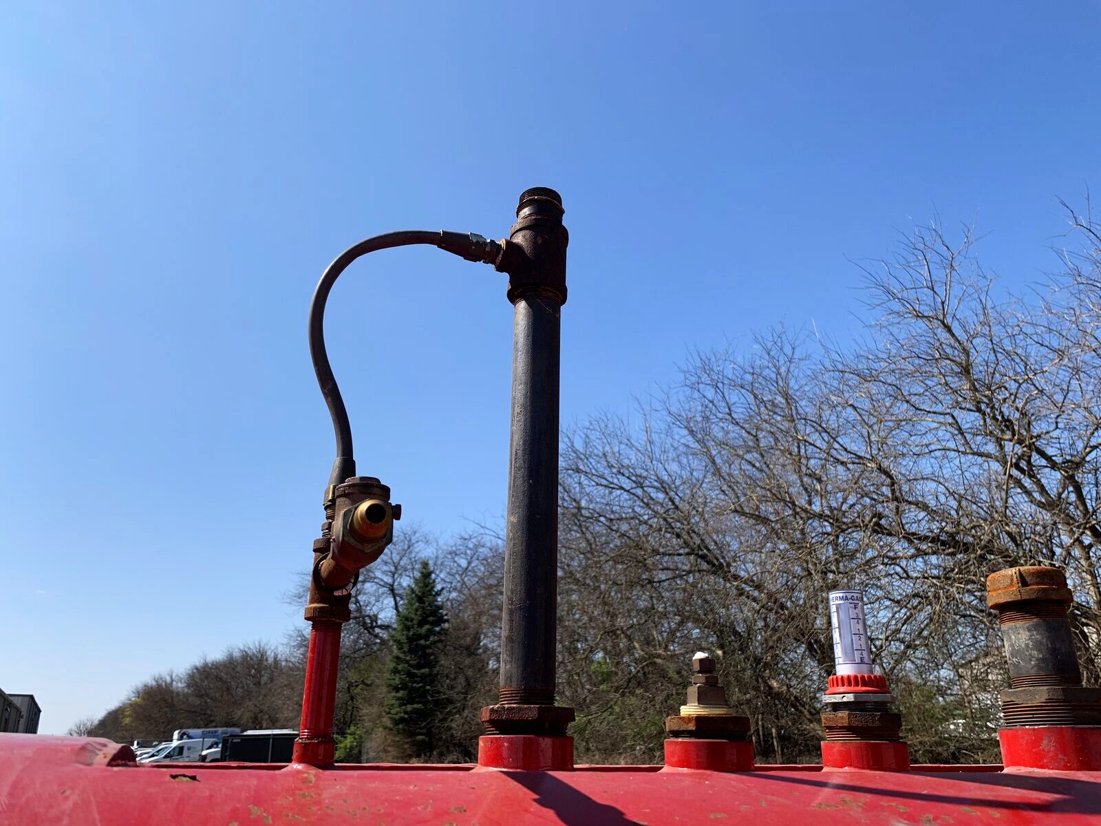 Configured fill line and transfer connection on a custom tank