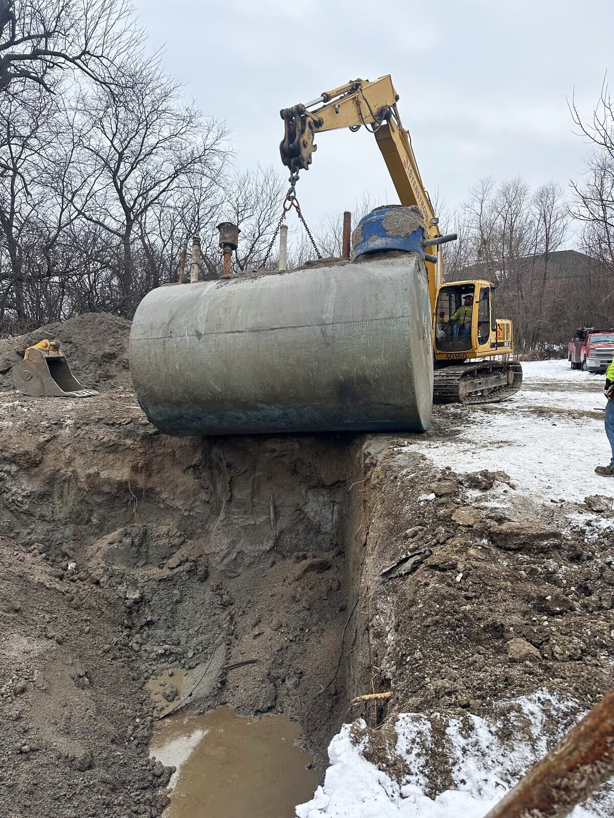 Chemical-grade storage tank with technician on access platform