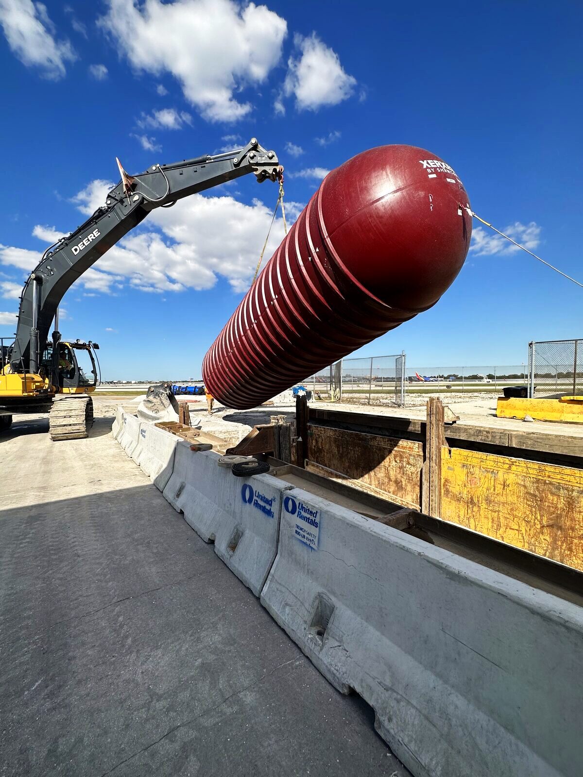 New fiberglass tank being lifted for placement