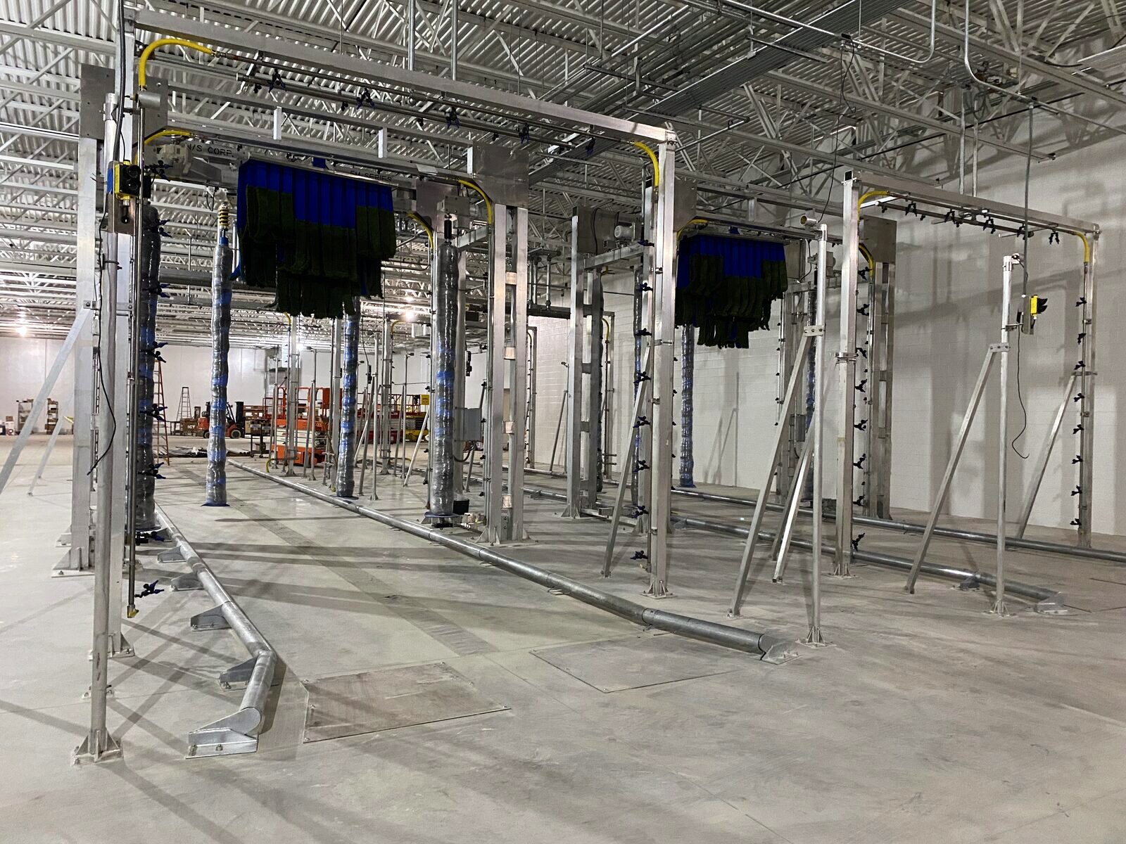 Brush gantries and equipment set in the wash lane